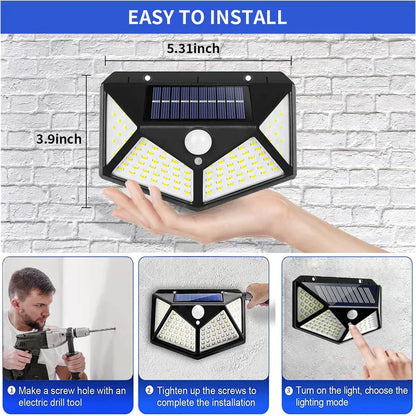 UK-0035 Solar Lights 100 LED Solar Security Light with Waterproof Wall Light Solar Powered and 3 Modes for Outdoor 1200mAh